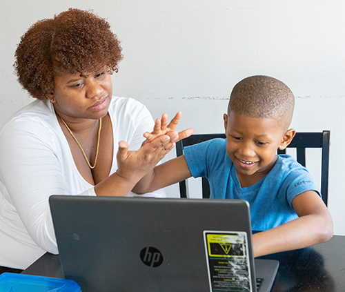 mother and son at a laptop